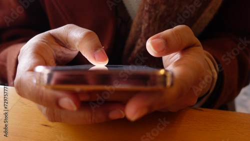 Close up of young women hand using smart phone. photo