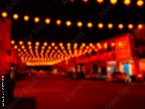 Blur photo of the lanterns that the man put up on the road to celebrate the Chinese New Year