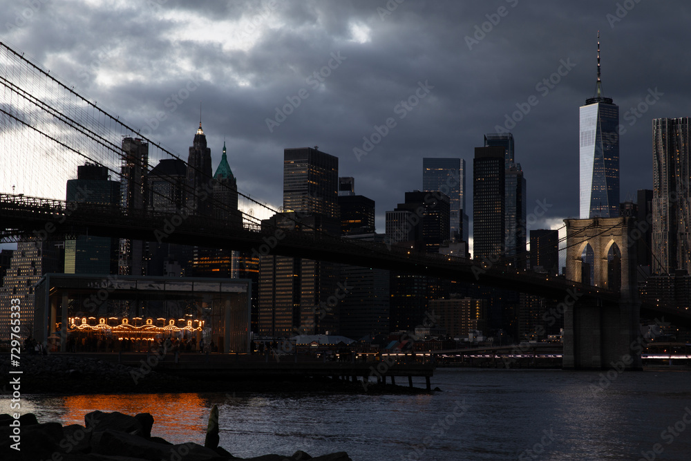 Manhattan skyline with Brooklyn Bridge illuminated