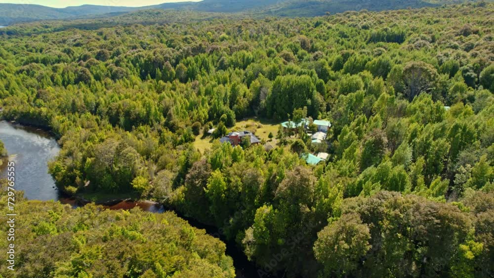 Aerial orbit of the lodge in tepuhueico park, forest zone, greenery in Chiloé, Chile. Aerial orbit of the lodge in tepuhueico park, forest zone, greenery in Chiloé, Chile.