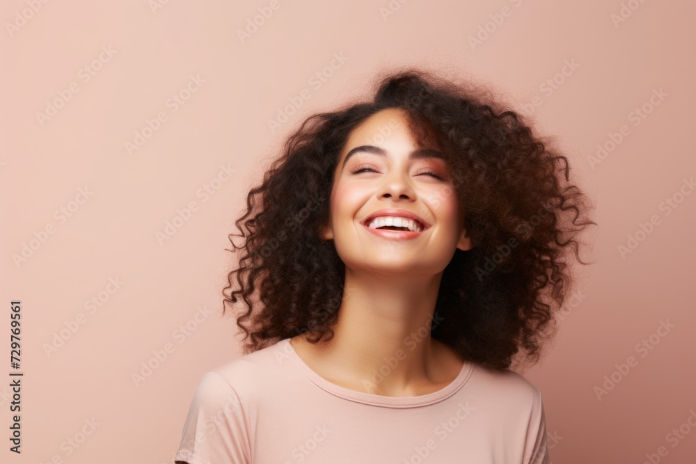 Portrait of a smiling young african american woman with curly hair Portrait of a smiling young african american woman with curly hair