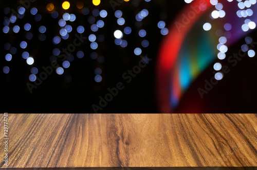 Empty dark wooden table in front of abstract blurred boken bankground of restaurant. Can used for display or montage your products. Mock up for space. photo