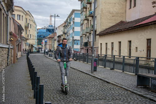 man riding electric roller in the city