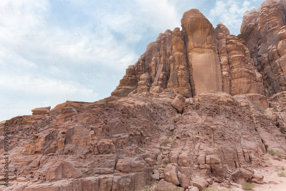Bizarre shapes of high mountains in red desert of Wadi Rum near Amman in Jordan