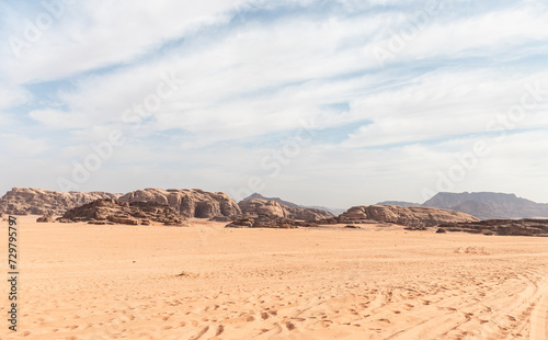 Low ridges of the mountains in the endless red desert of the Wadi Rum near Amman in Jordan
