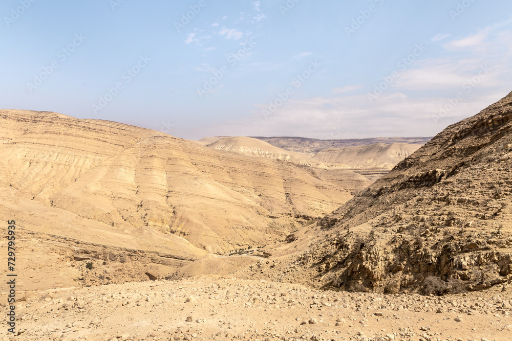 View of the low mountains in the gorge Wadi Al Ghuwayr or An Nakhil and the wadi Al Dathneh from the road leading to it near Amman in Jordan