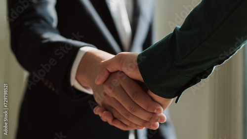 businessman making handshake to success deal to be partnership. Two business men agreement company trade partnership handshake, dealing, merger and acquisition, business partner joint venture concept. photo