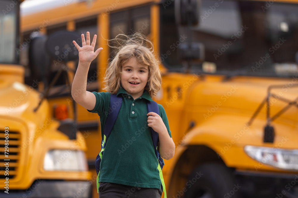 Education concept. Schoolboy getting on the school bus. American School ...