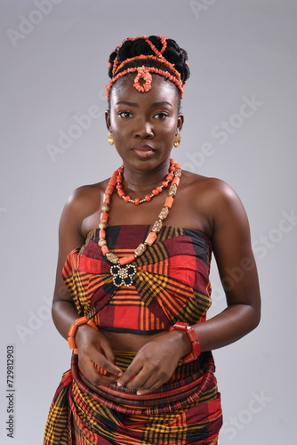 Young black African Nigerian igbo looking gorgeous wearing native attire facing camera photo