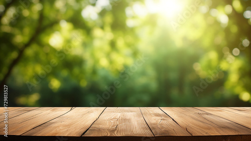 Empty wood table with green nature blur background © Yuwarin