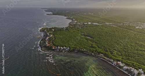 Akumal Mexico Aerial v7 high birds eye view, flyover bay capturing stunning coastal landscape and seafront resort hotels and vacation homes with ocean views - Shot with Mavic 3 Pro Cine - July 2023 photo