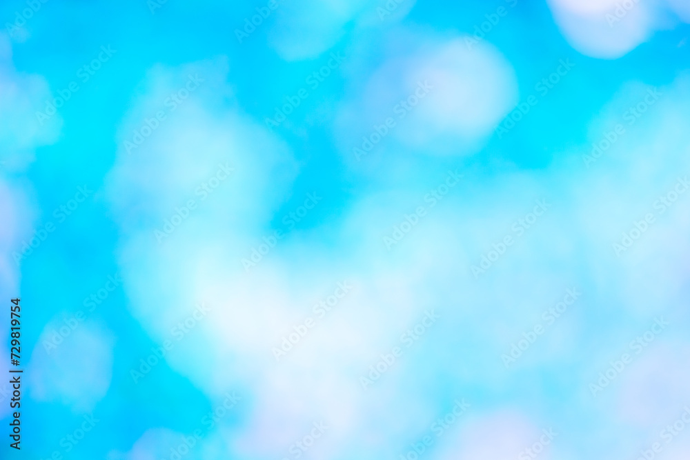 Abstract bright blue background out of focus bokeh.
