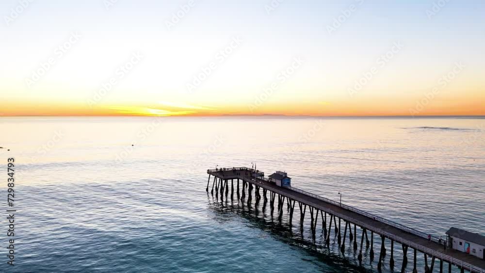 Aerial View of southern california pier with a beautful orange sunset Aerial View of southern california pier with a beautful orange sunset