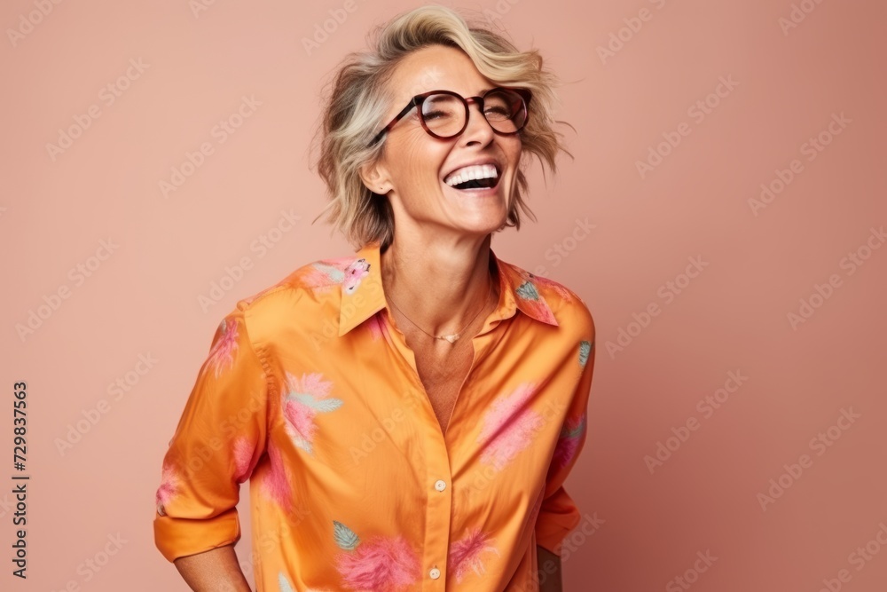Portrait of a happy senior woman with eyeglasses over pink background Portrait of a happy senior woman with eyeglasses over pink background