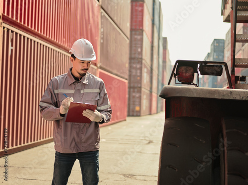 Engineers walking and checking condition Forklift container .