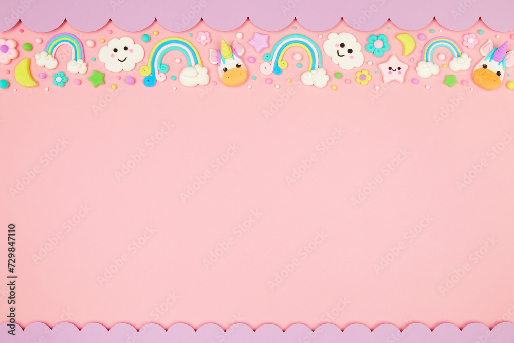 Trendy pastel pink kawaii background with cute air plasticine handmade cartoon animals, unicorns, stars, rainbows pattern border. Top view, flat lay, copy space. Candycore, fairycore.