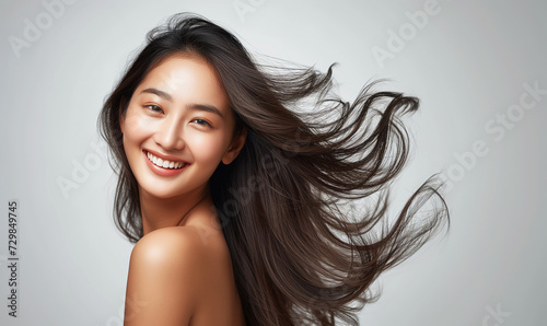 Portrait of a beautiful woman with a bright smile, hair is a beautiful black color, shampoo advertising concept Hair conditioner and cosmetic products,Generative AI photo