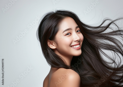 Portrait of a beautiful woman with a bright smile, hair is a beautiful black color, shampoo advertising concept Hair conditioner and cosmetic products,Generative AI