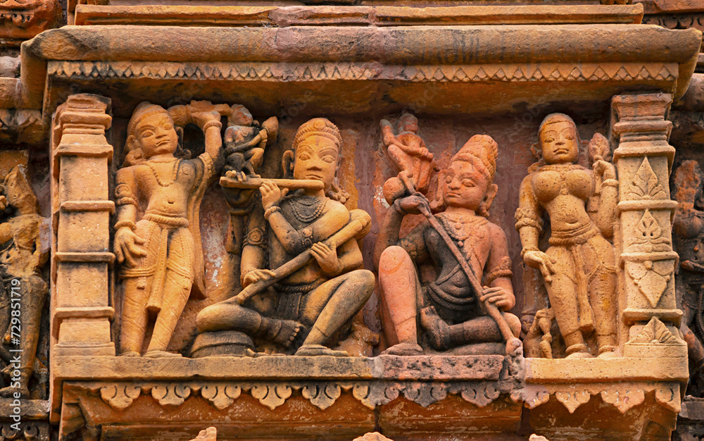 Sculpture of Lord Krishna With Mira on the Sun Temple, 11th Century Temple, Jhalarapatan, Rajasthan, India.