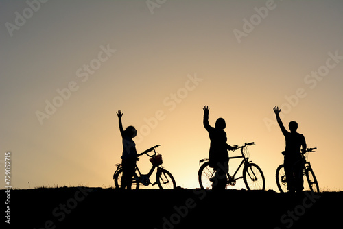 Being in nature with a family bike trip consisting of mother, father and child © emerald_media