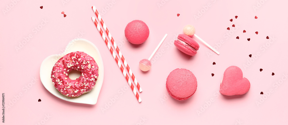 Different tasty sweets on pink background. Valentine's Day celebration