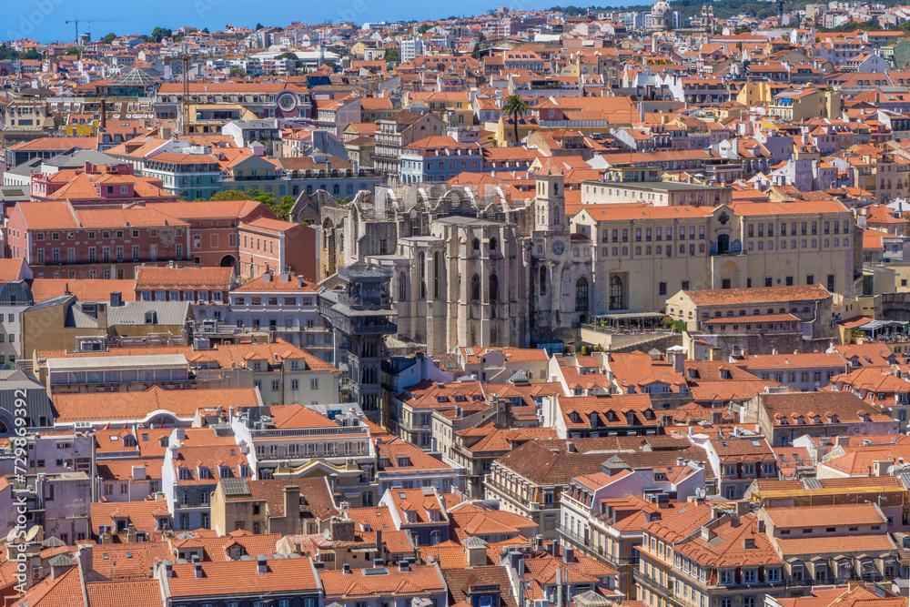Aerial view from the Castle of Saint George with panoramic views of the Church of the Convento do Carmo and the Elevador de Santa Justa elevator, with the roofs of the city of Lisbon, Portugal