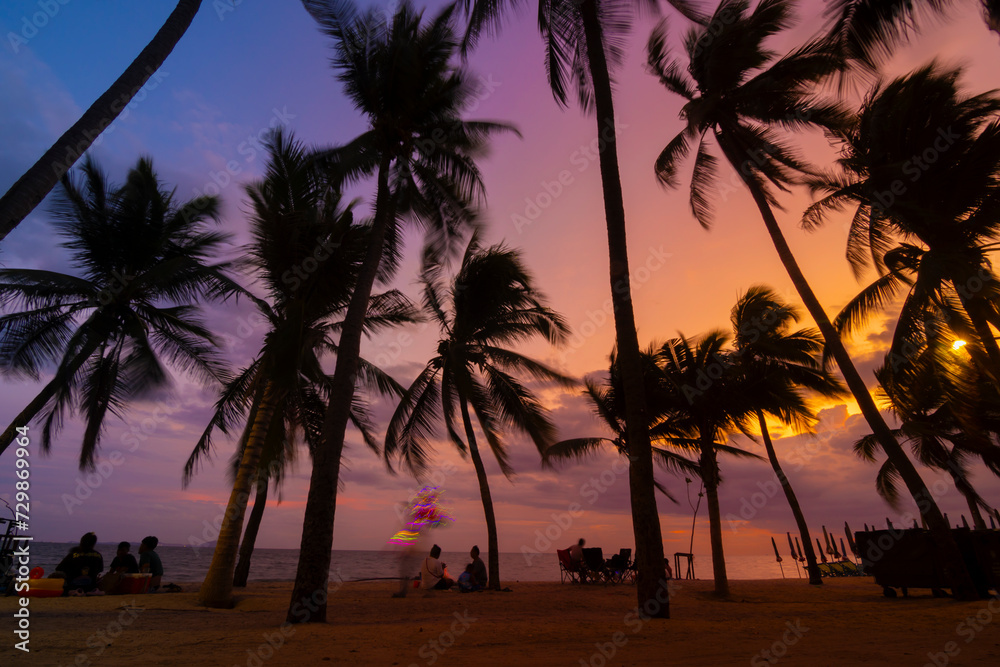 Fototapeta premium Sandy Beach Sunset with Palm Trees and Tropical Sky