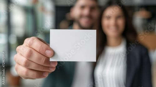 A Woman Is Holding A Business Card