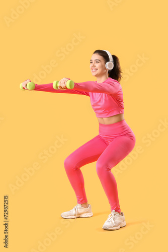 Young woman in headphones t...
