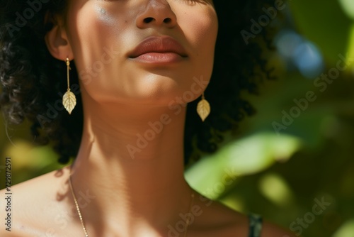 closeup on model with leaf earrings  leaf necklace