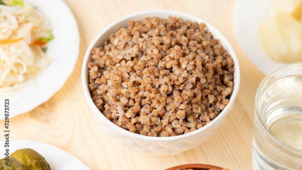 A dish of healthy cereals - buckwheat porridge in a clay bowl, Selective focus A dish of healthy cereals - buckwheat porridge in a clay bowl, Selective focus