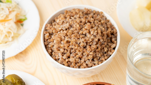A dish of healthy cereals - buckwheat porridge in a clay bowl, Selective focus