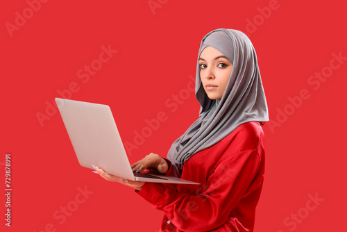 Young Muslim woman in hijab...