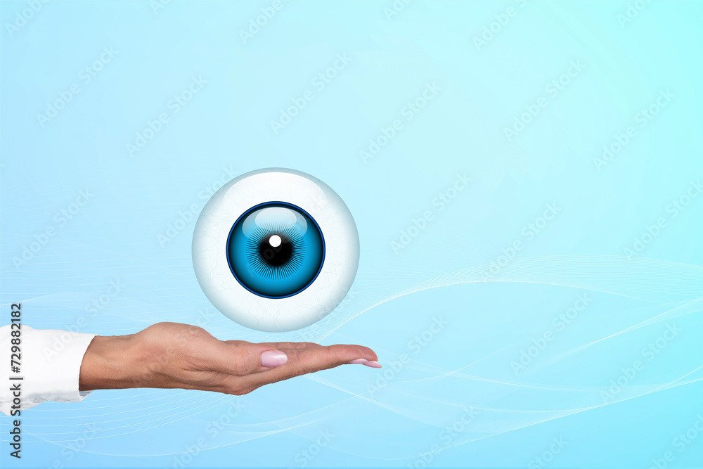 Obraz premium Realistic human eye with blue cornea in the form of a round icon on the palm of a doctor, woman. Gradient blue background. Copy space.