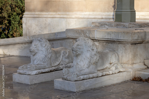 Fototapeta Naklejka Na Ścianę i Meble -  Statues of lions in front of the entrance to Metropolitan Cathedral, Athens, Greece