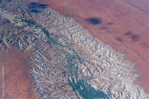 worn banks of Nossob river in Kalahari desert, south of Leonardville, Namibia photo