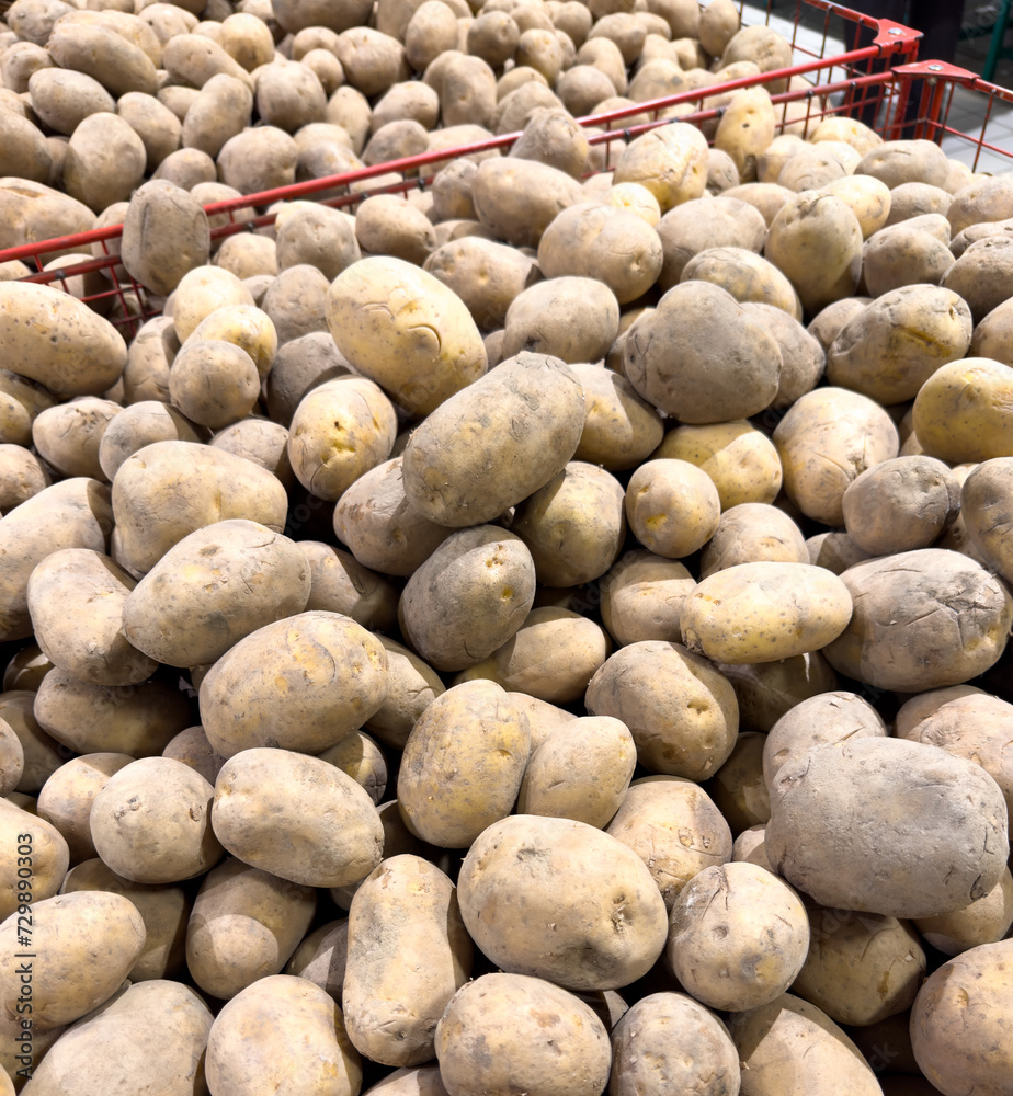 Fresh potatoes on the counter in the market Fresh potatoes on the counter in the market