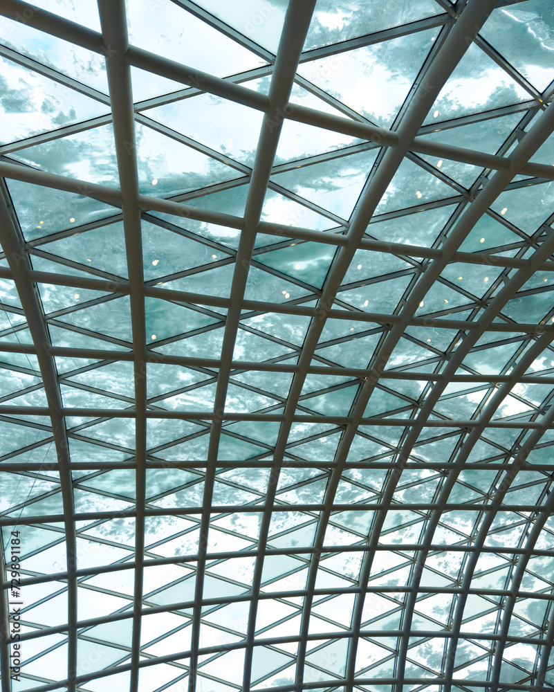 A glass roof in a building covered with snow as an abstract background. Texture