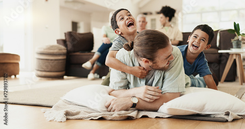 Funny, playing and father with children on floor in home living room laughing at comedy, joke or humor. Happy, dad and kids having fun, bonding and enjoying family time together in adoption house. photo