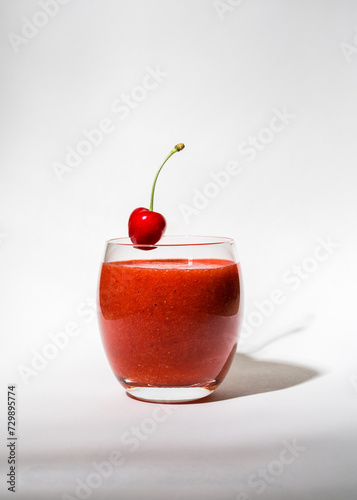 Wallpaper Mural Glass with strawberry, red smoothie and on a white background. There's a cherry on the glass. Summer drink. Vitamins, diet, proper nutrition, vegan Torontodigital.ca