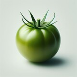 green tomato on a white