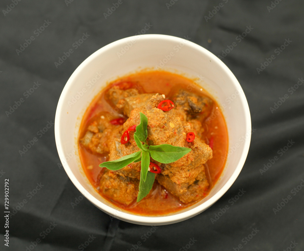 Cakalang Rica - Special Food from Manado Indonesia, made from Skipjack Fish Cooked in Spicy Aromatic Sambal. Served on white plate. Top view.
Cakalang Rica - Special Food from Manado Indonesia, made from Skipjack Fish Cooked in Spicy Aromatic Sambal. Served on white plate. Top view.