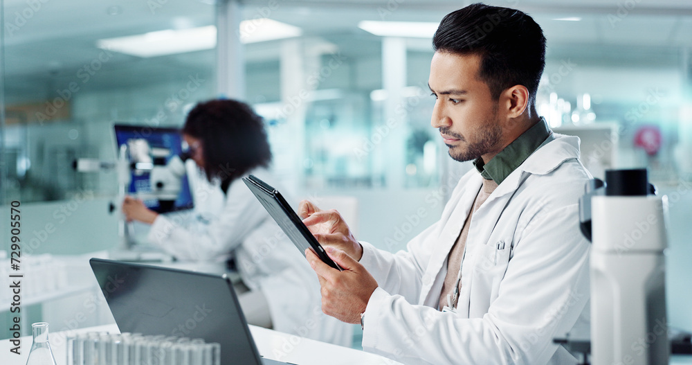 Scientist, man and tablet for laboratory research, DNA analysis and results in medical study at night. Young science expert or people in biotechnology, digital software or computer for test checklist Scientist, man and tablet for laboratory research, DNA analysis and results in medical study at night. Young science expert or people in biotechnology, digital software or computer for test checklist