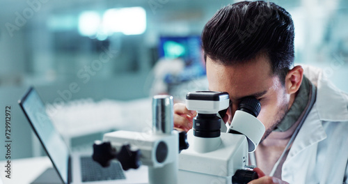 Microscope, man or scientist in research laboratory for medical test or biotechnology development. Engineer, science or person working on medicine chemistry, chemical and forensic biology or vaccine