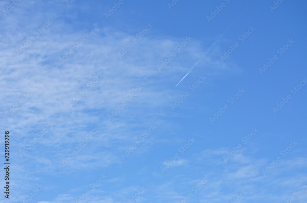 a person flying a kite in the sky a person flying a kite in the sky