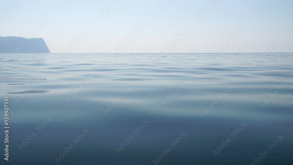 Sea water surface. Low angle view from kayak, camera flies over clear sea water. Nobody. Holiday recreation concept. Abstract nautical summer ocean nature. Slow motion. Close up. Vertical video Sea water surface. Low angle view from kayak, camera flies over clear sea water. Nobody. Holiday recreation concept. Abstract nautical summer ocean nature. Slow motion. Close up. Vertical video
