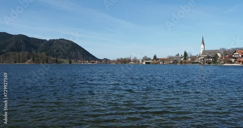 Landscapes of the Bavarian Alps. The town of Schliersee and Saint Sixtus Church along the northern shore of the lake in front of Freudenberg at the end of the western shore photo