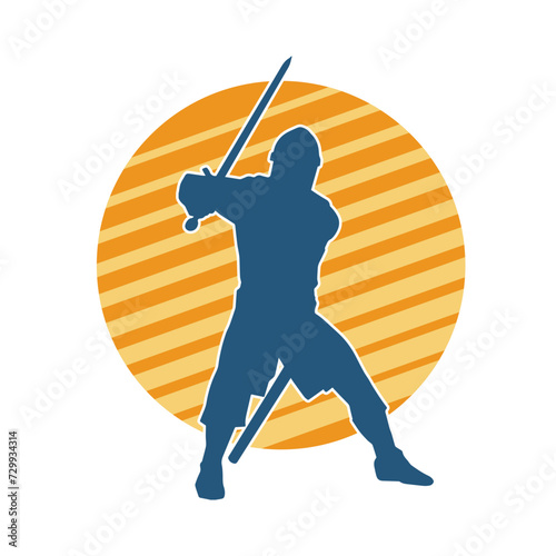 Silhouette of a male warrior in action pose with sword weapon. Silhouette of a man fighter carrying sword weapon.