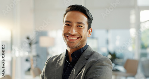Crossed arms, laugh and face of business Asian man in office for leadership, empowerment and success. Corporate, manager and portrait of happy person in workplace for ambition, pride and confidence photo