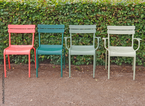 Four Colorful plastic chairs in the park